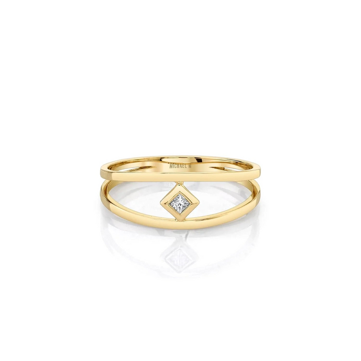 A yellow gold ring in the middle of a white background. The ring features a diamond-set center piece and two yellow-gold rows with Michael M. engraved inside the ring.