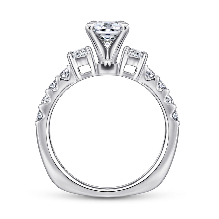 Profile view of a princess cut three stone engagement ring showing the elevated center setting, open side galleries and diamond-set band.