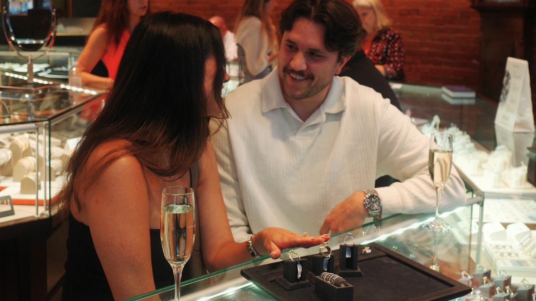 Couple exploring diamond engagement rings during a bridal consultation at Richter & Phillips Jewelers in Cincinnati.