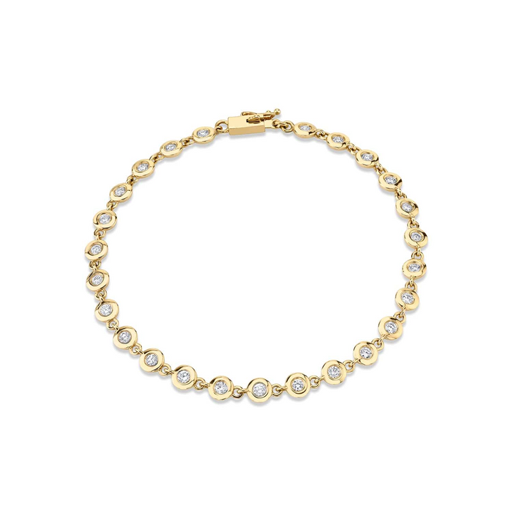 A front view of a yellow gold diamond tennis bracelet against a white background. The diamond bracelet features round bezels with diamonds.