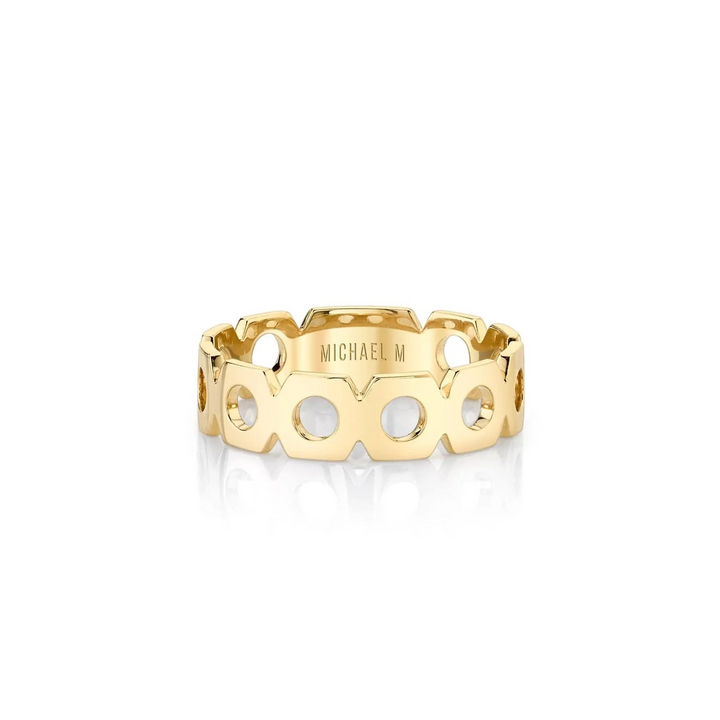 A front view of a yellow gold wedding band against a white background. The ring features an eternity-style design with a continuous loop of hexagonal shapes and a blank round space at its center.