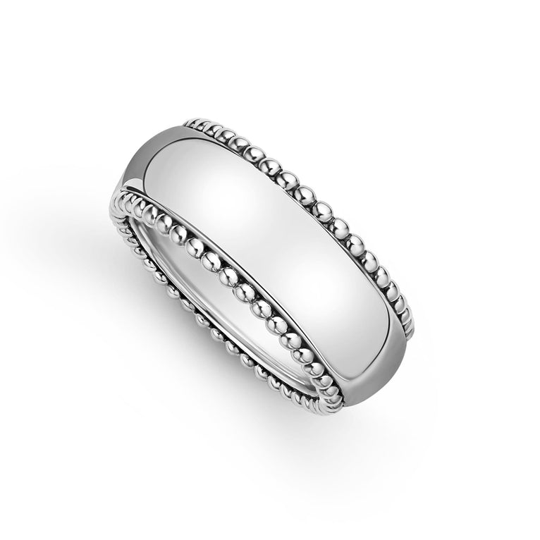 A white gold ring is angled to the left against a white background. The ring features a white gold band and caviar beading around the edges.