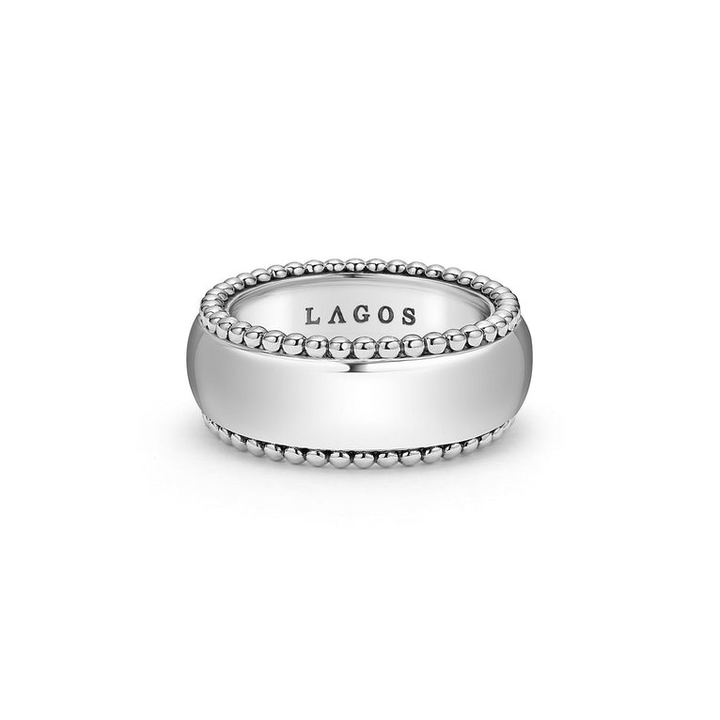 A front view of a white gold wedding band against a white background. The ring features smooth sterling silver and caviar beading around the edges.