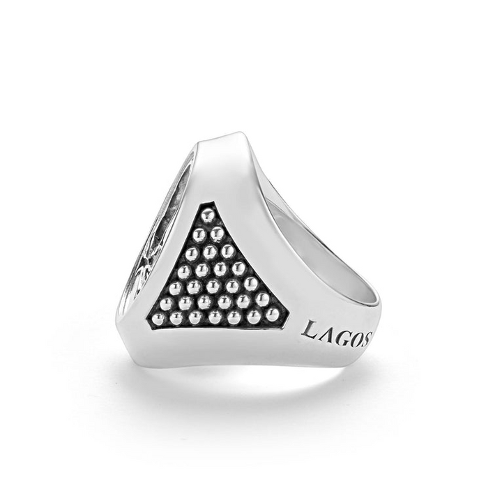 A front view of a signet ring against a white background. The ring features a skull motif that forms this Sterling silver signet ring.