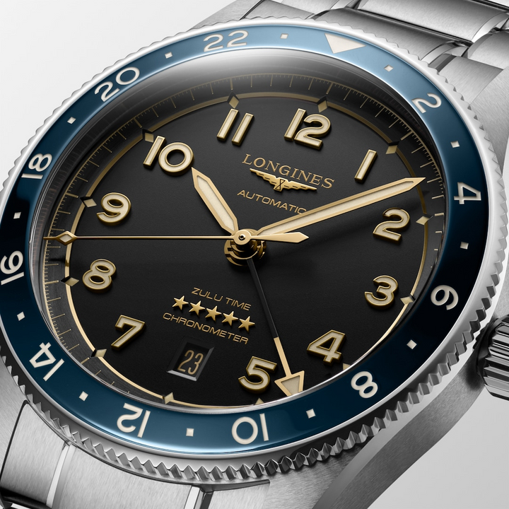 Close up view of the dial of a LONGINES Spirit Zulu Time watch with an anthracite dial and a stainless steel bracelet.
