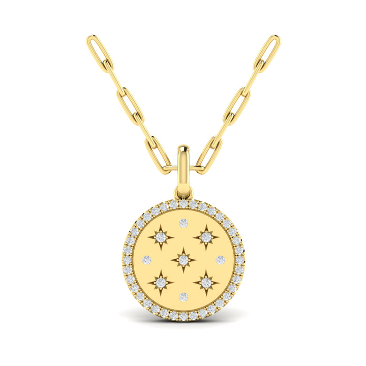 A front view of a yellow gold pendant necklace is set against a white background. The circular pendant necklace features nine round-shaped diamonds, star motifs, a diamond-set halo, and a yellow gold chain.