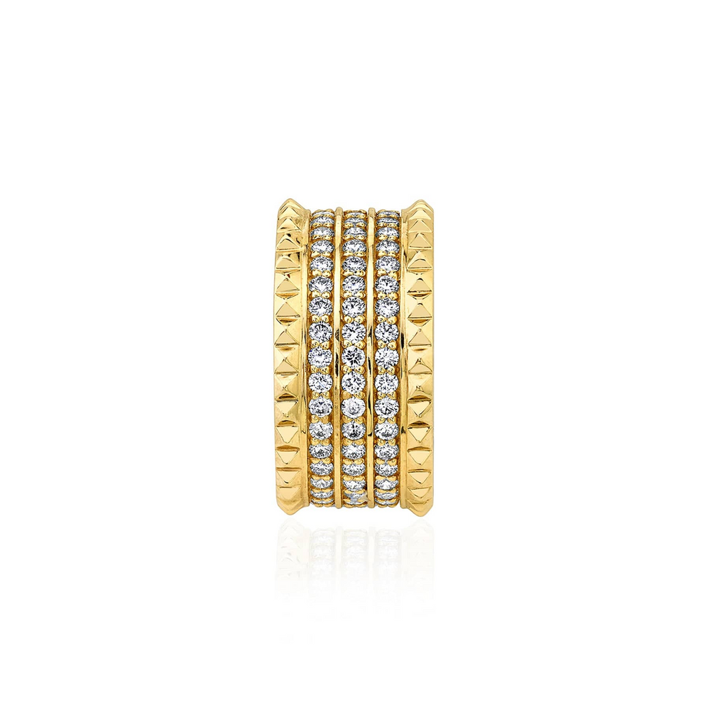 A side view of a yellow gold diamond ring against a white background. The ring features a gold band ring with three rows of sparkling round diamonds set pavé between two bands of miniature pyramid studs.