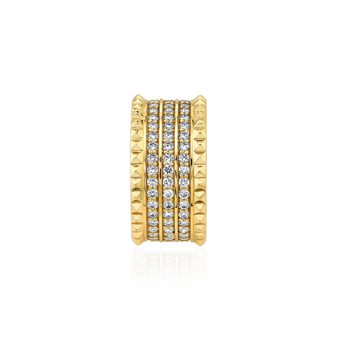 A side view of a yellow gold diamond ring against a white background. The ring features a gold band ring with three rows of sparkling round diamonds set pavé between two bands of miniature pyramid studs.