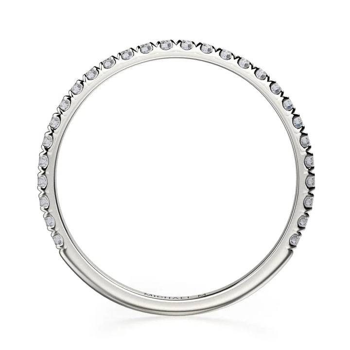 A top view of a white gold wedding band against a white background. The ring features a 3/4 eternity style with brilliant round-shaped prong-set diamonds.