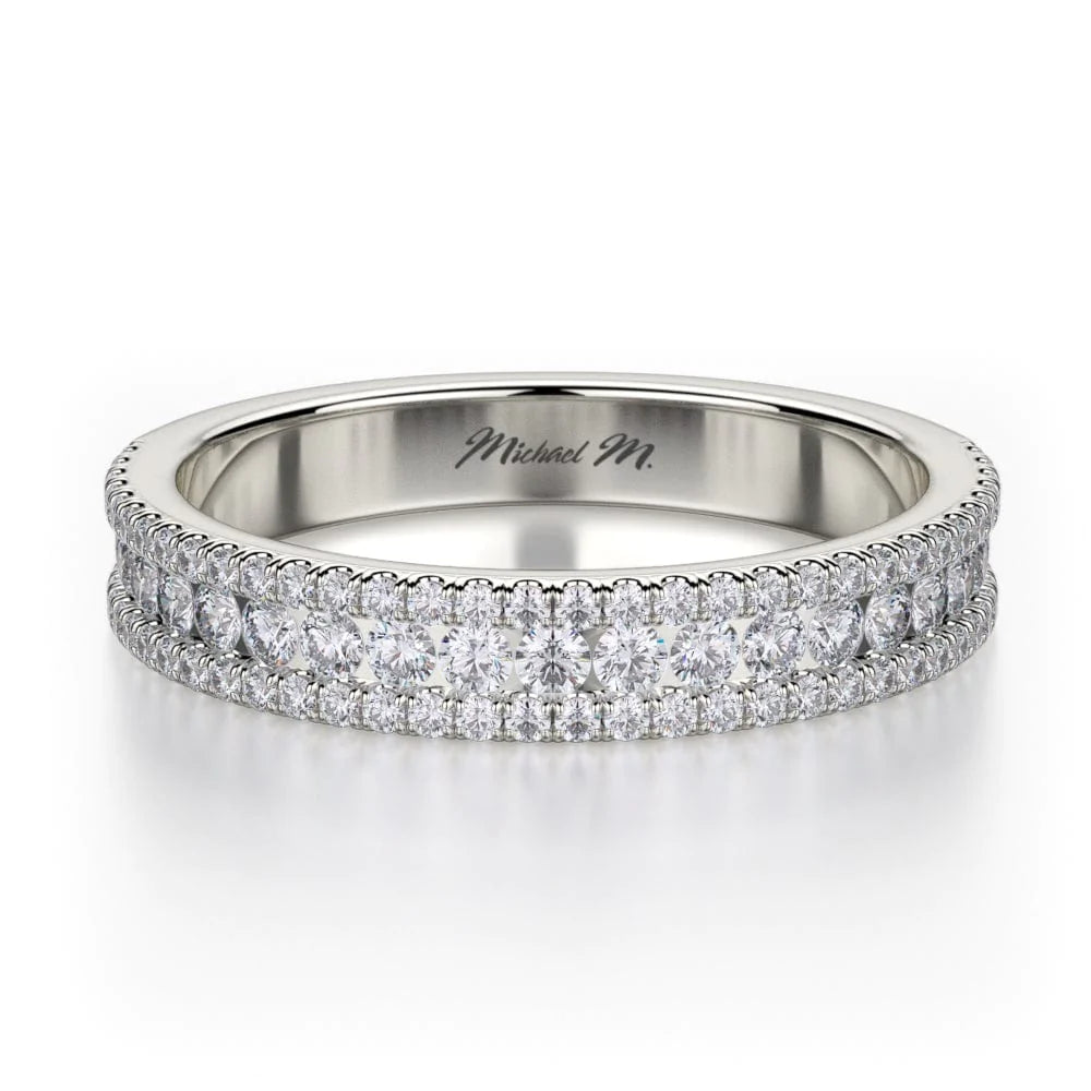 A front view of a platinum wedding band against a white background. The ring features a half-eternity style with three rows of brilliant, round-shaped, prong-set diamonds.