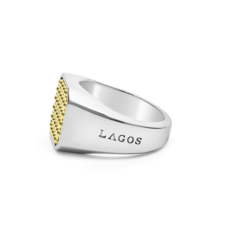 A side view of a yellow gold ring against a white background. The ring features a square gold bead motif in the middle and a thick silver band.