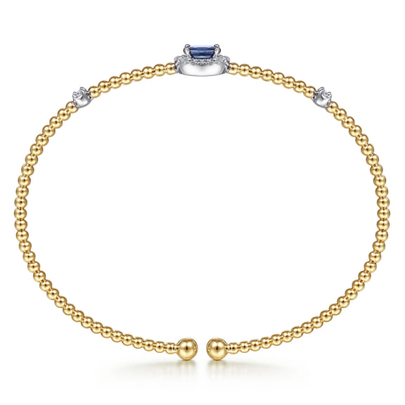 Rear view of the Gabriel & Co Bujukan bangle showing the open gallery beneath the sapphire and the beaded gold band.