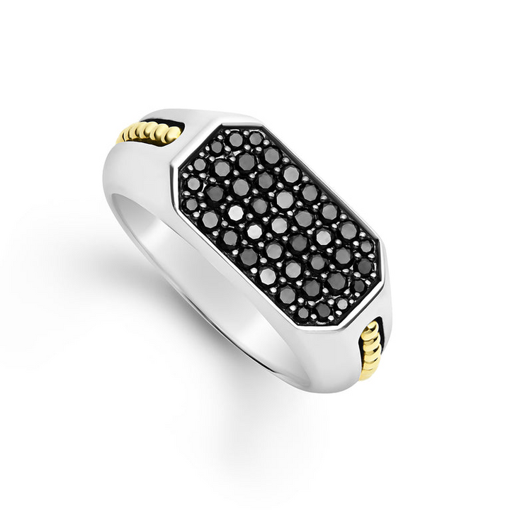 An angled view of a sterling silver and 18k yellow gold ring against a white background. The ring features an octagon-shaped center piece with Black diamonds accented by sterling silver and 18K gold Caviar beading.