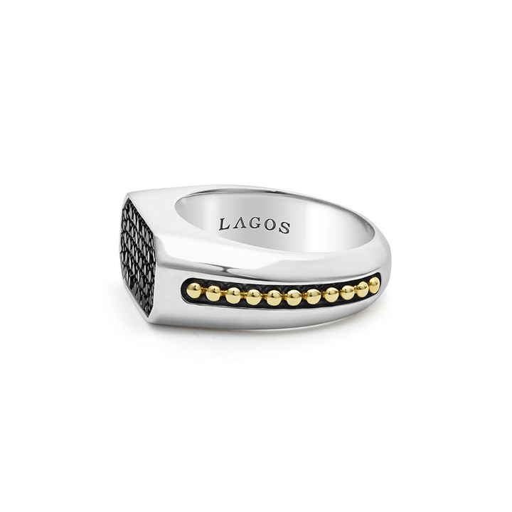A side view of a sterling silver and 18k yellow gold ring against a white background. The ring features an octagon-shaped center piece with Black diamonds accented by sterling silver and 18K gold Caviar beading.