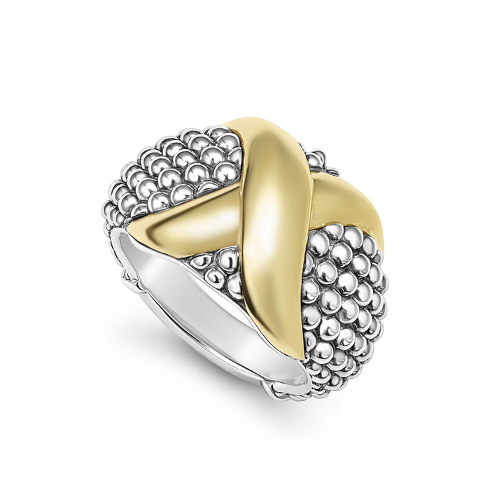 An angled view of a sterling silver and 18k yellow gold ring against a white background. The ring features a two-tone dome-shaped ring with 18K gold and sterling silver caviar beading.
