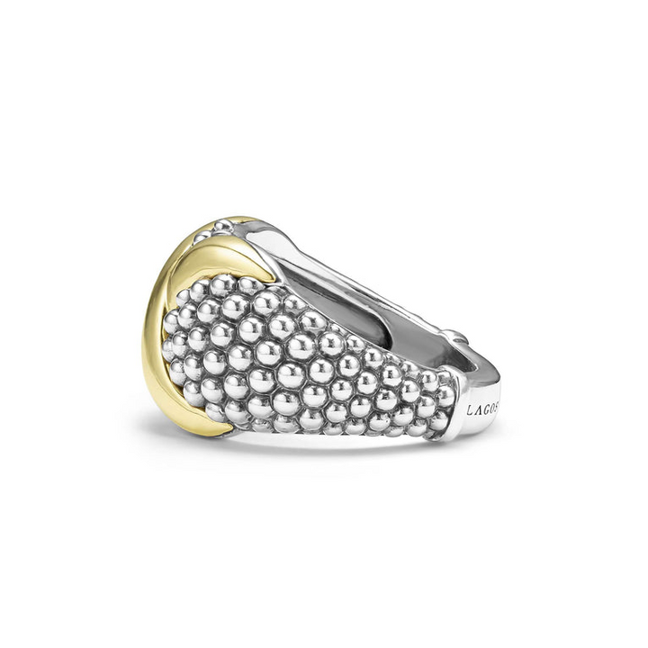 A side view of a sterling silver and 18k yellow gold ring against a white background. The ring features a two-tone dome-shaped ring with 18K gold and sterling silver caviar beading.