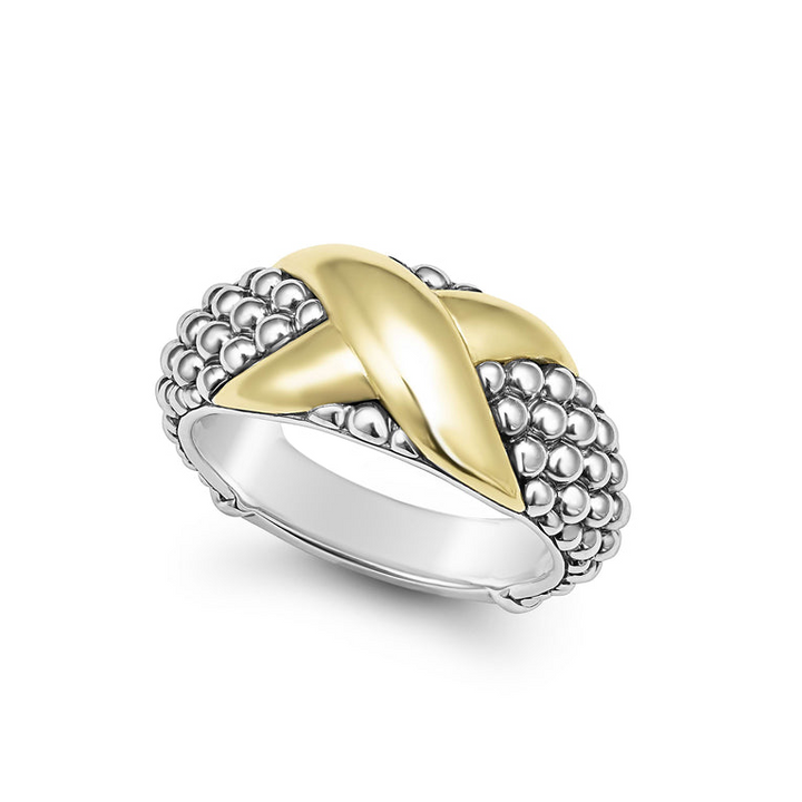 An angled view of a sterling silver and 18k yellow gold ring against a white background. The ring features a two-tone ring with 18K gold and sterling silver caviar beading.