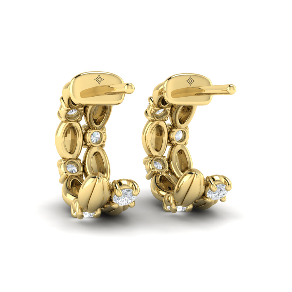 Rear view of Vlora Madeleine yellow gold diamond hoop earrings, showing the backs of the sculpted hoops and closures.