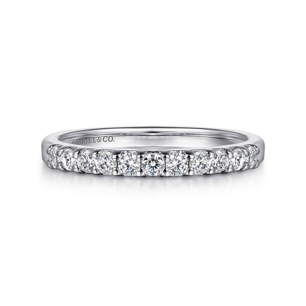 A front view of a white gold wedding band against a white background. The ring features 11 sparkling round-shaped diamonds set in a straight line.