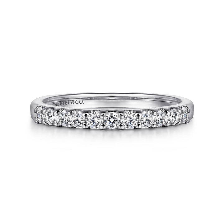 A front view of a white gold wedding band against a white background. The ring features 11 sparkling round-shaped diamonds set in a straight line.
