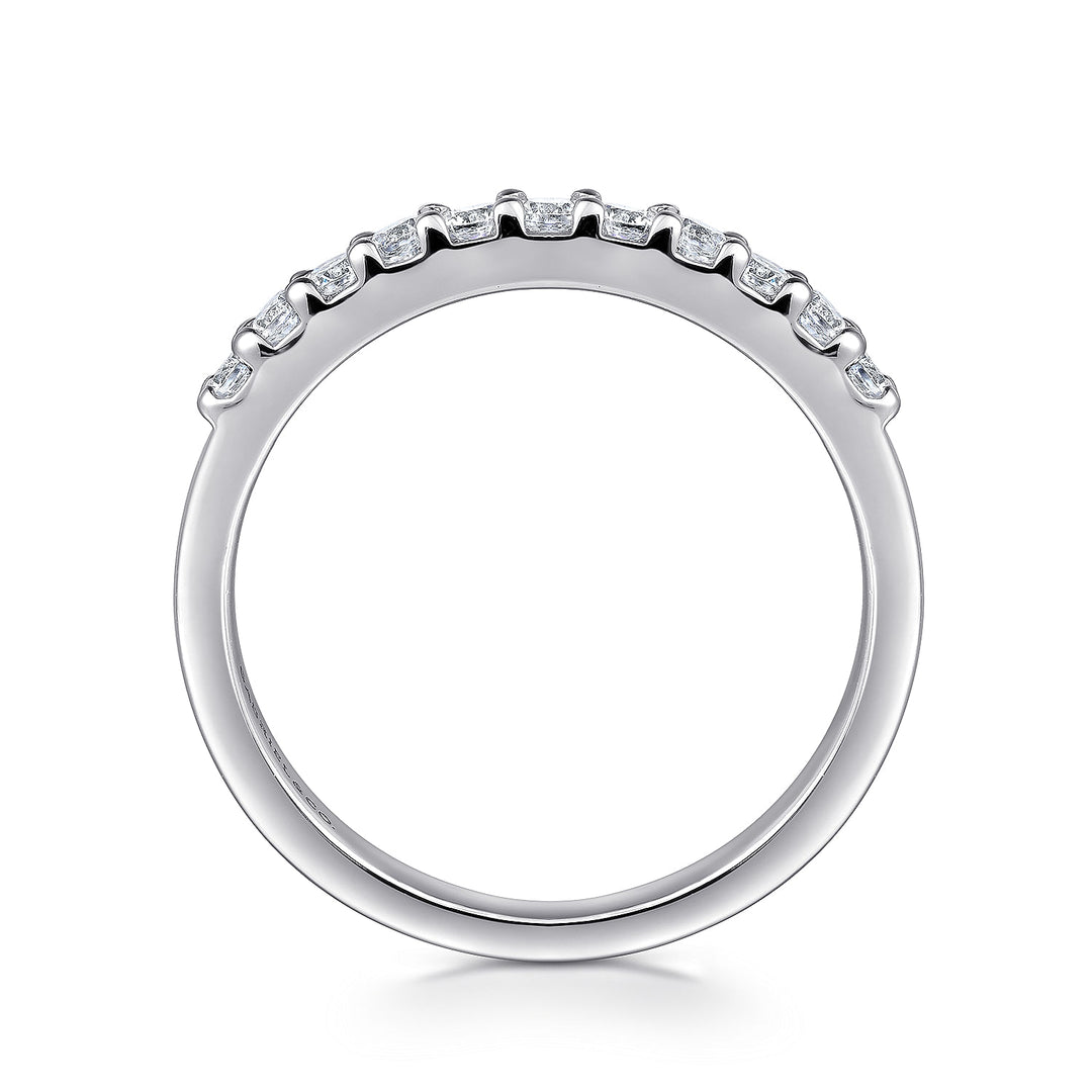 A side profile view of a white gold wedding band against a white background. The ring features 11 sparkling round-shaped diamonds set in a straight line.
