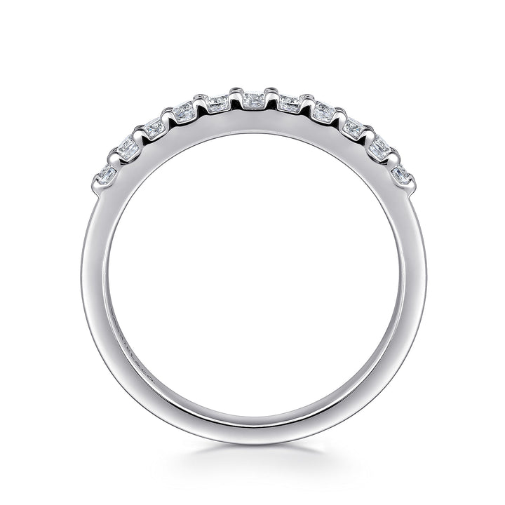 A side profile view of a white gold wedding band against a white background. The ring features 11 sparkling round-shaped diamonds set in a straight line.