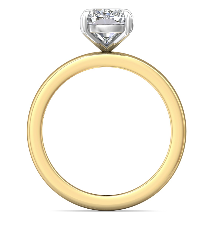 Profile view of a two-tone solitaire engagement ring showing the open white gold basket above the yellow gold band.