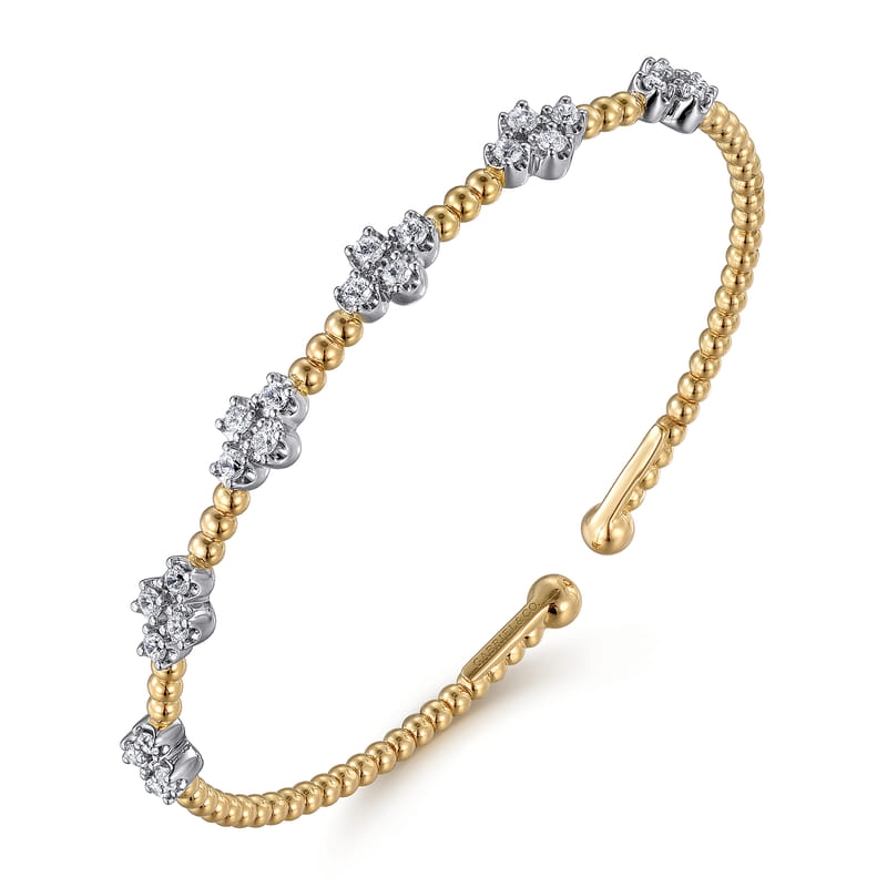 Gabriel & Co Bujukan open bangle with a beaded yellow gold band and two diamond-set tips in white gold.