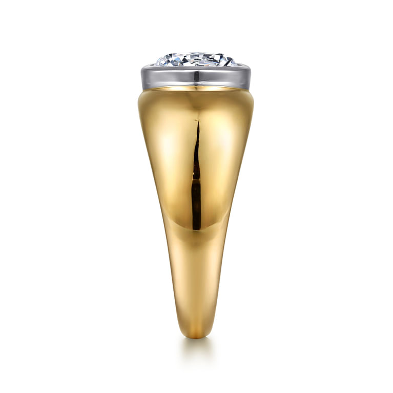 End view of a yellow gold dome engagement ring showing the white gold bezel and wide shoulders tapering toward the base.
