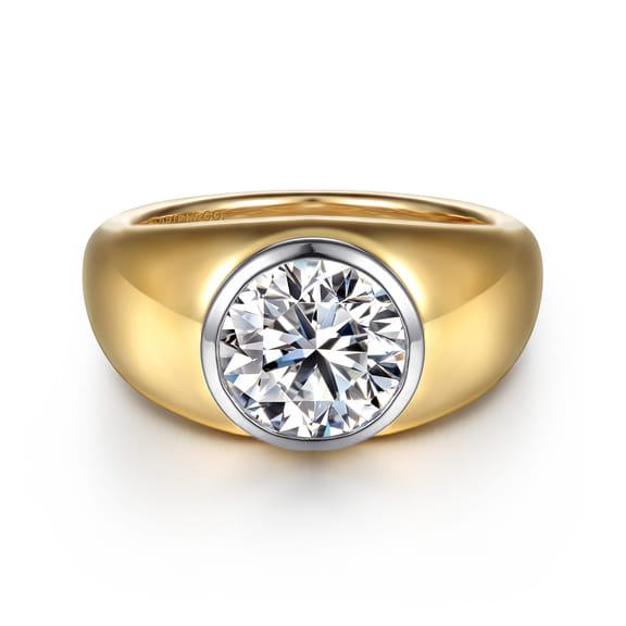 Front view of a round diamond engagement ring with a white gold bezel and wide polished yellow gold dome band.
