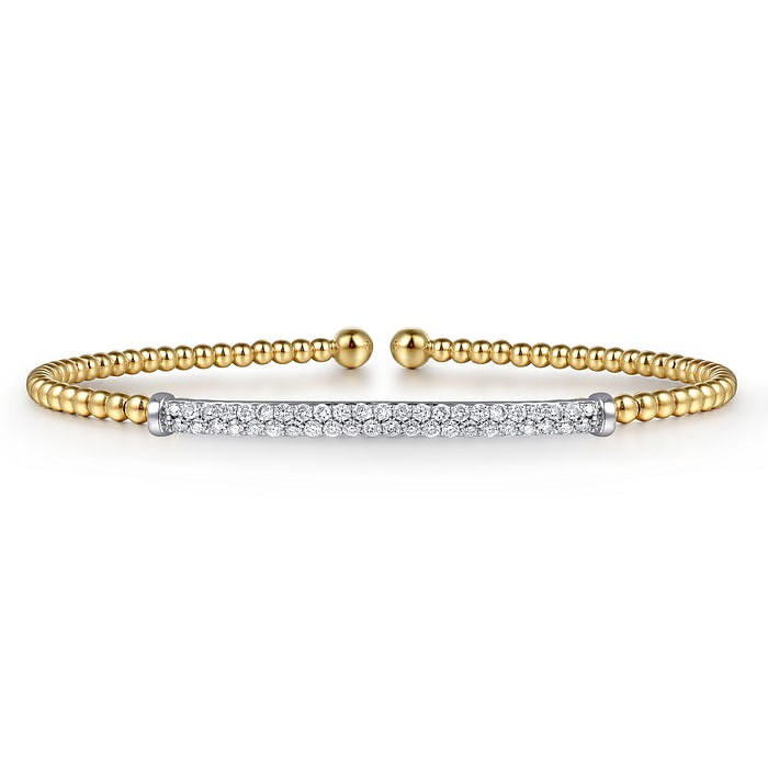 Gabriel & Co Bujukan split bangle in 14K yellow gold with beaded detailing, a diamond bar and rounded open ends.